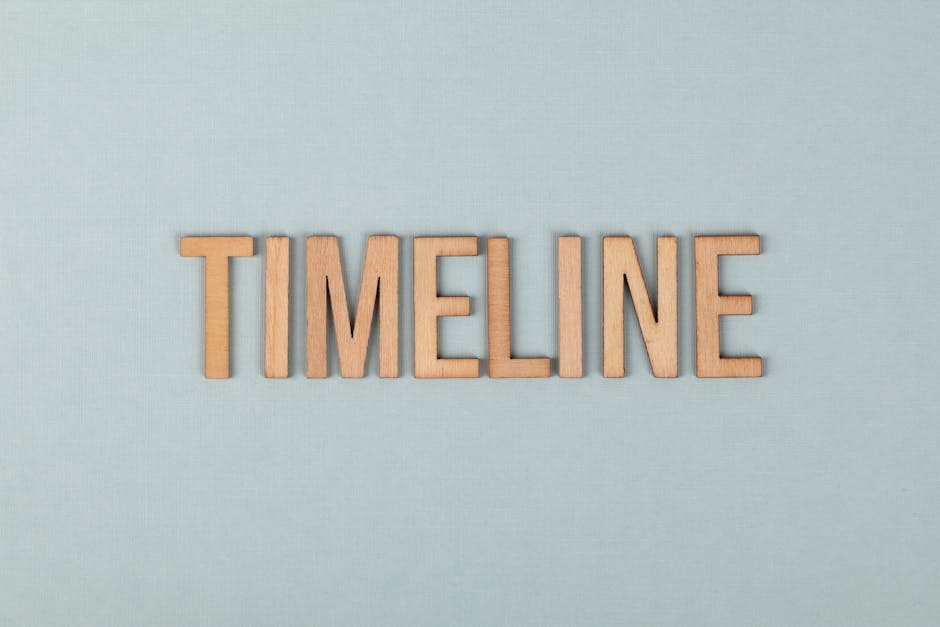 Wooden letters forming the word timeline on a light blue background, perfect for presentations.