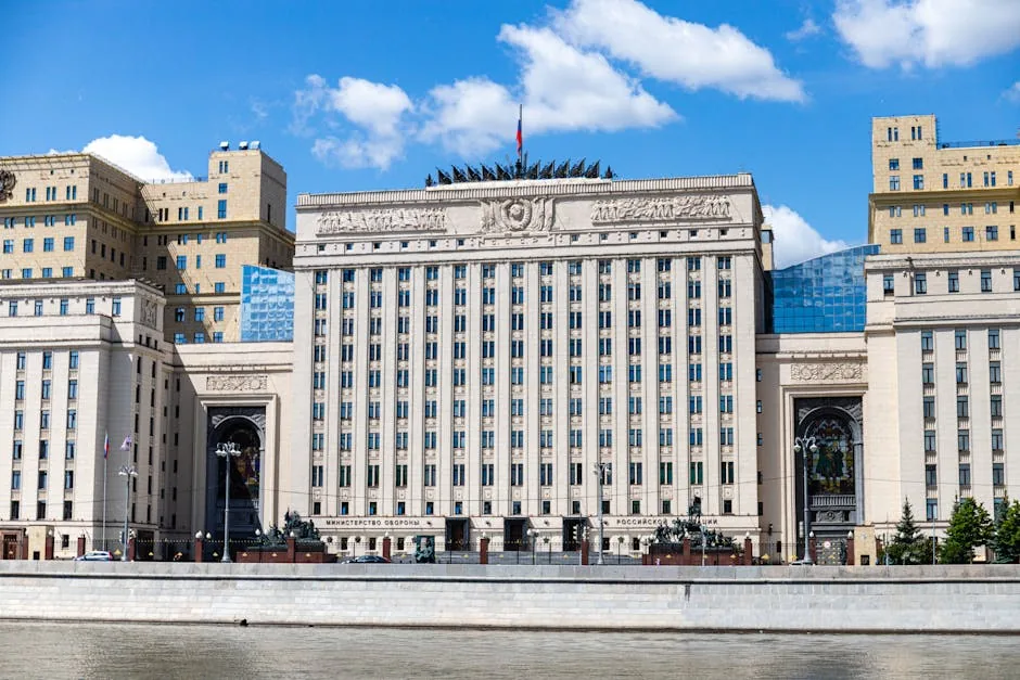 Facade of the Russian Ministry building in Moscow along the river under a clear sky.